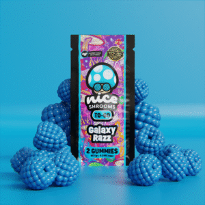 galaxy razz mushroom gummies on a blue background surrounded by blue raspberries